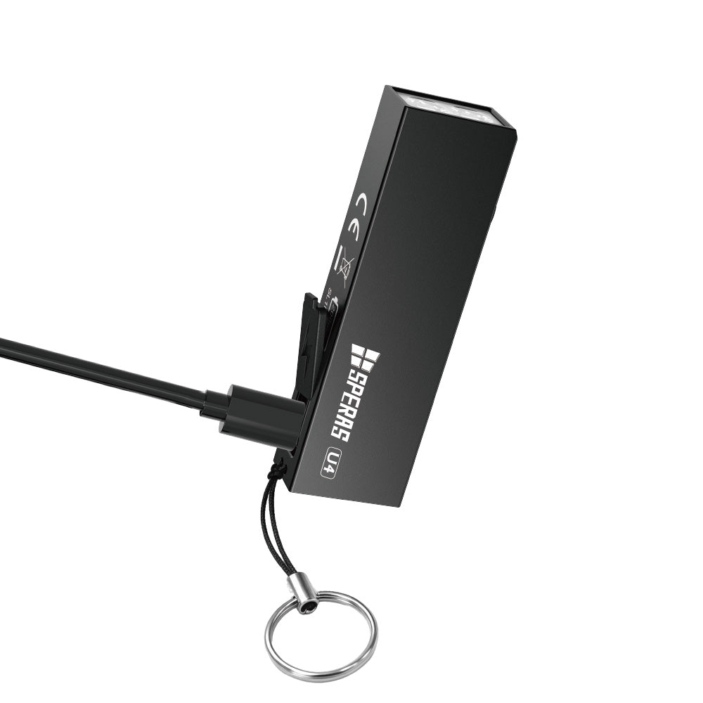 SPERAS U4 black USB-C rechargeable keychain light plugged in with charging cable and keyring attached