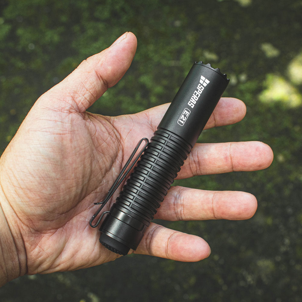 SPERAS E21 everyday carry flashlight resting in palm showing compact dimensions