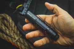 Ultra compact 115mm SPERAS ST20 EDC flashlight held in hand highlighting its heavy duty double sided pocket clip
