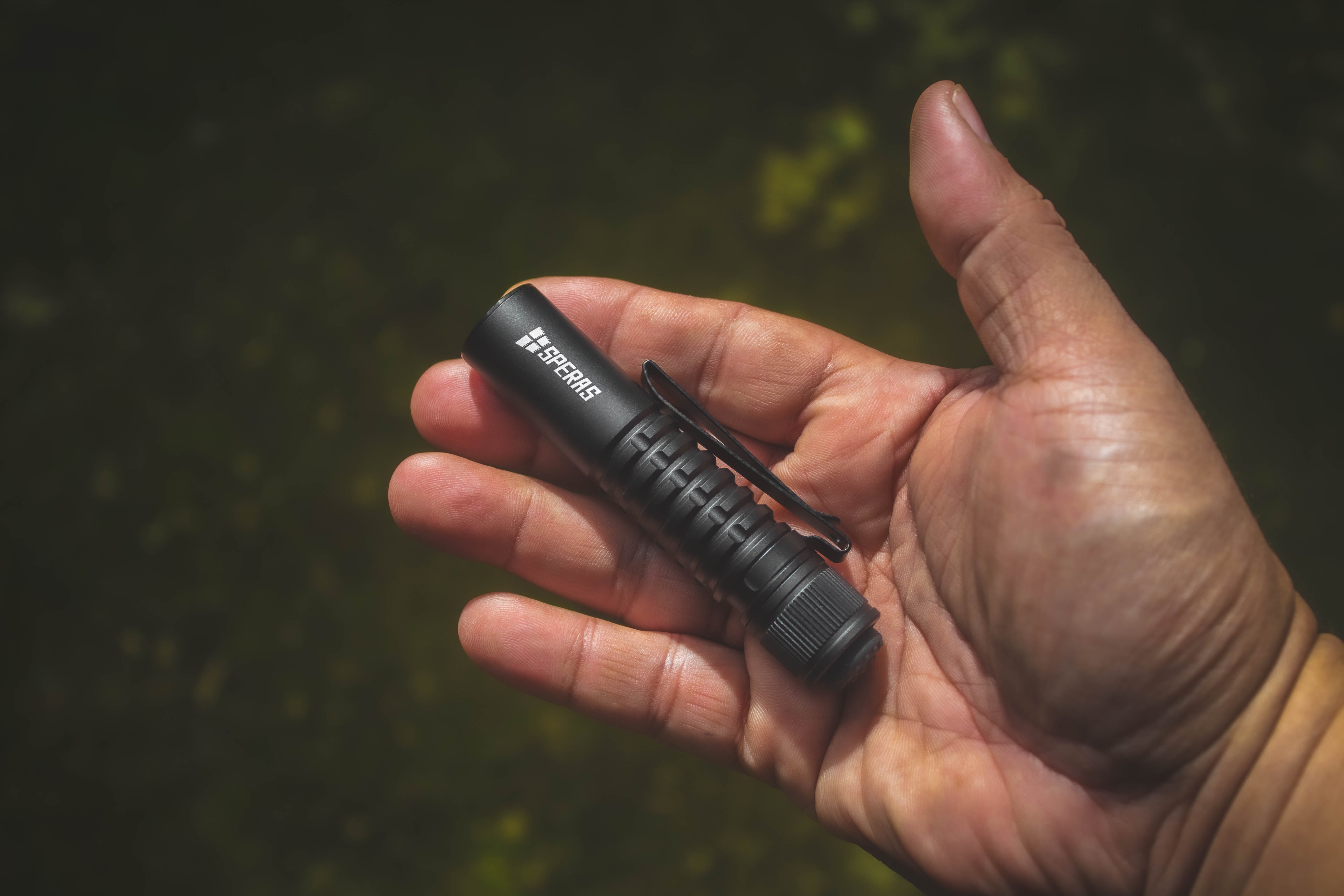 Ultra compact 93.4mm SPERAS EST SE pocket torch weighing only 40g resting comfortably in the palm of a hand
