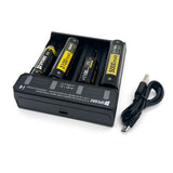 SPERAS i4 smart charger loaded with various Li-ion batteries charging independently, alongside its USB cable