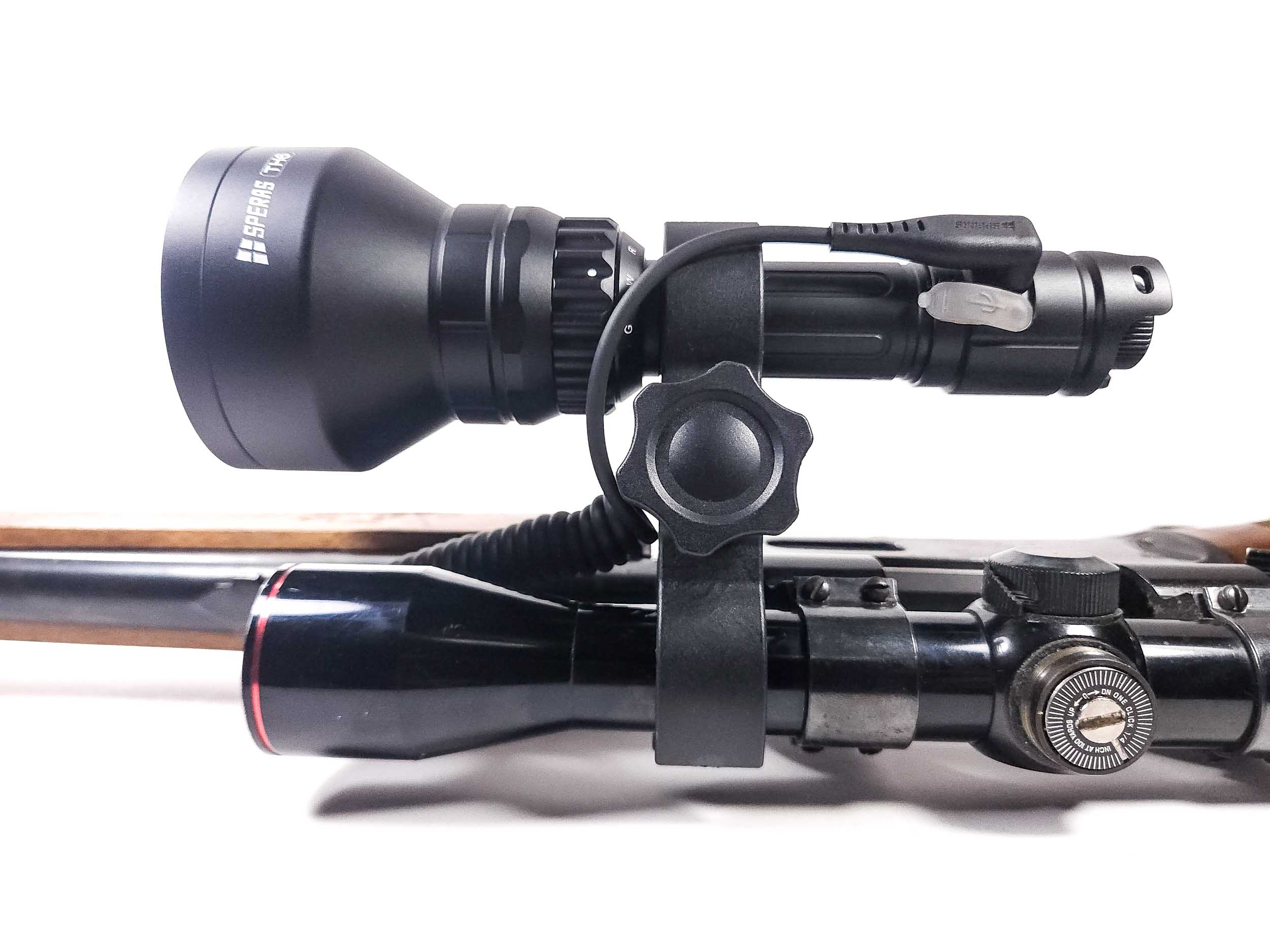 SPERAS TH6 long-range hunting flashlight securely mounted on outdoor equipment for nocturnal tracking